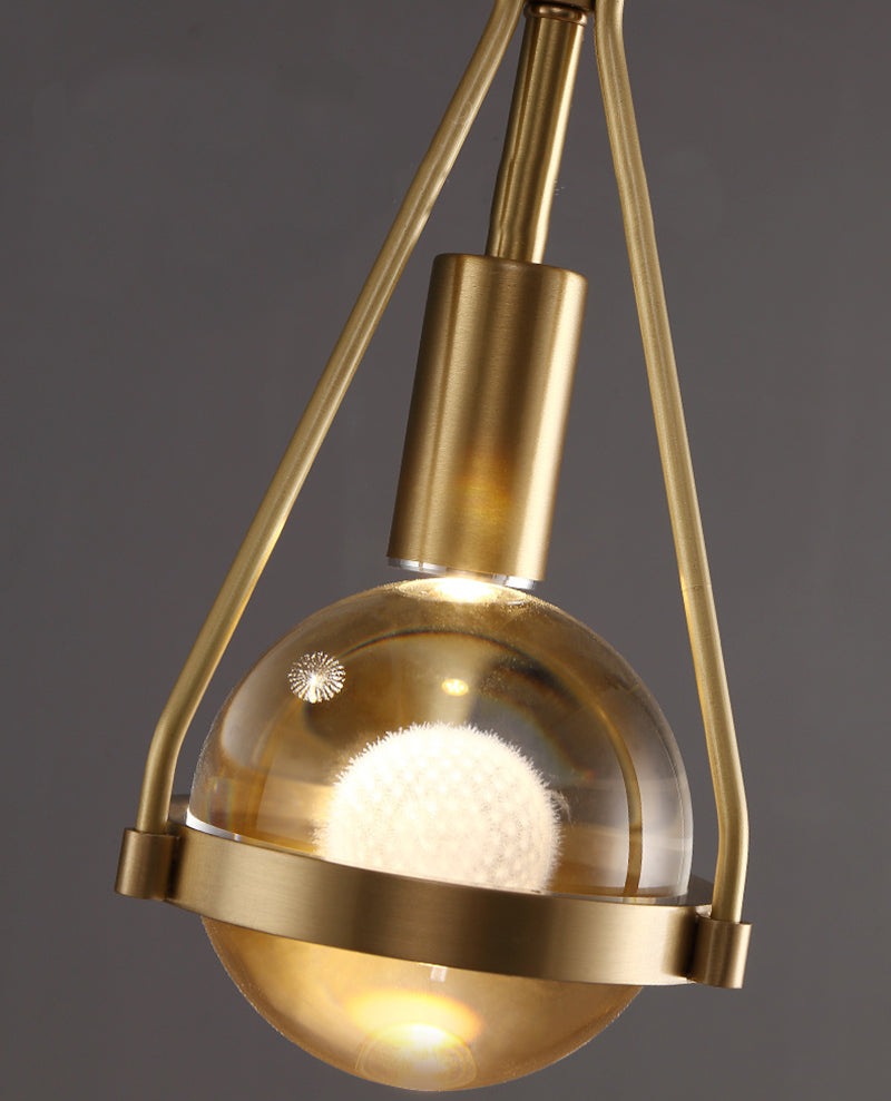 Shiny LED Glass Raindrop Wall Light with Brushed Brass Frame in Modern & Contemporary Style Close up