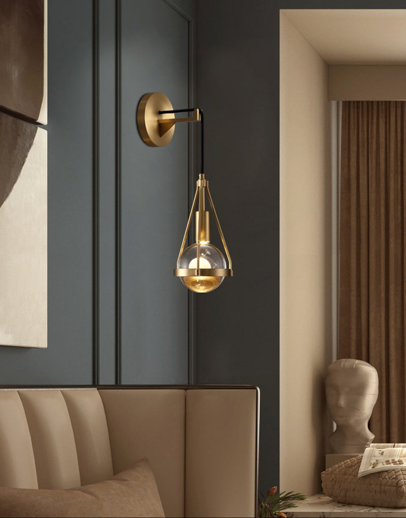 Shiny LED Glass Raindrop Wall Light with Brushed Brass Frame in Modern & Contemporary Style in Art Deco Living Space